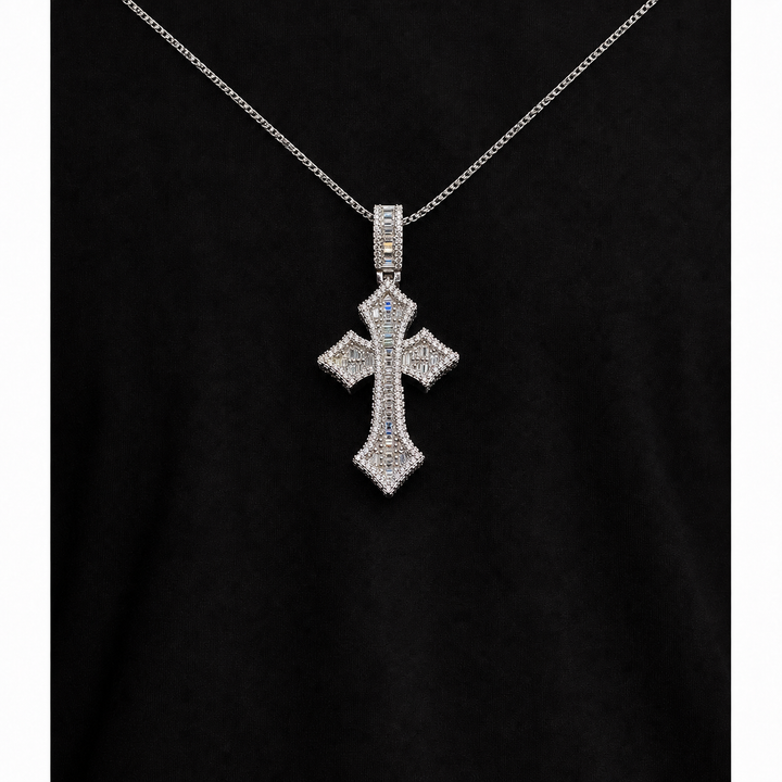 Silver-tone Gothic cross pendant worn on a fine chain over black