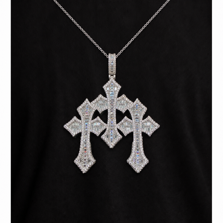 Silver-tone triple Gothic cross pendant worn over black