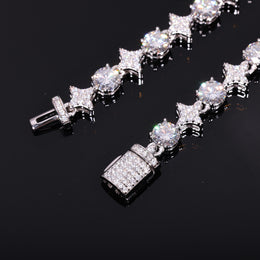 Close-up of silver-tone moissanite star links, round stones and stone-set clasp ends