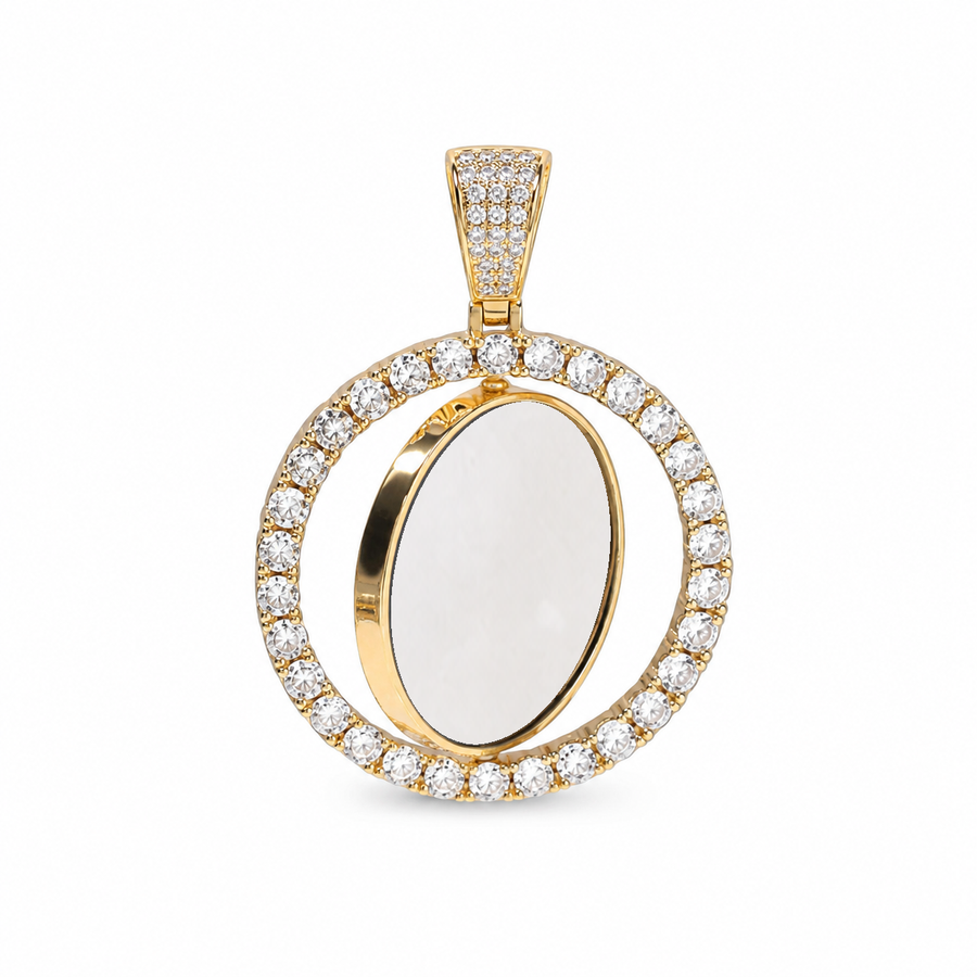 Gold-tone rotating photo pendant showing a white photo area on the tilted inner disc