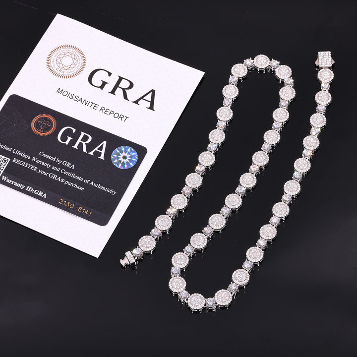 Silver-tone moissanite halo tennis chain beside GRA report papers and a card on black