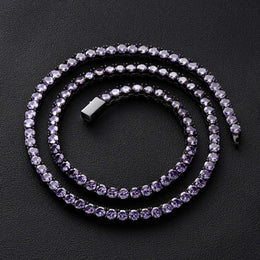 Dark-background detail view of 4mm iced gunmetal purple CZ tennis chain necklace