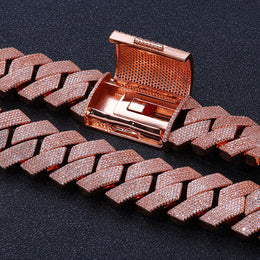 Open rose gold-tone hinged box clasp on black fabric