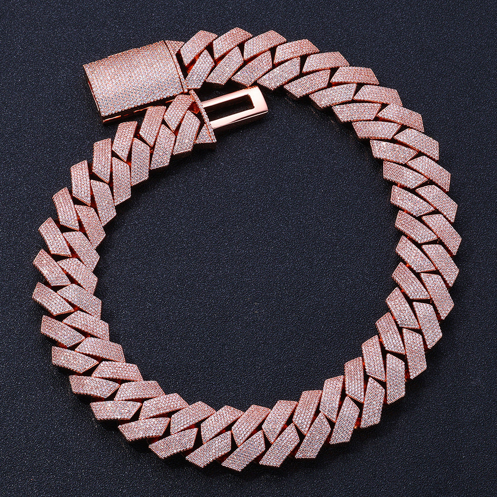 Rose gold-tone iced Cuban links laid in a circle with the box clasp open
