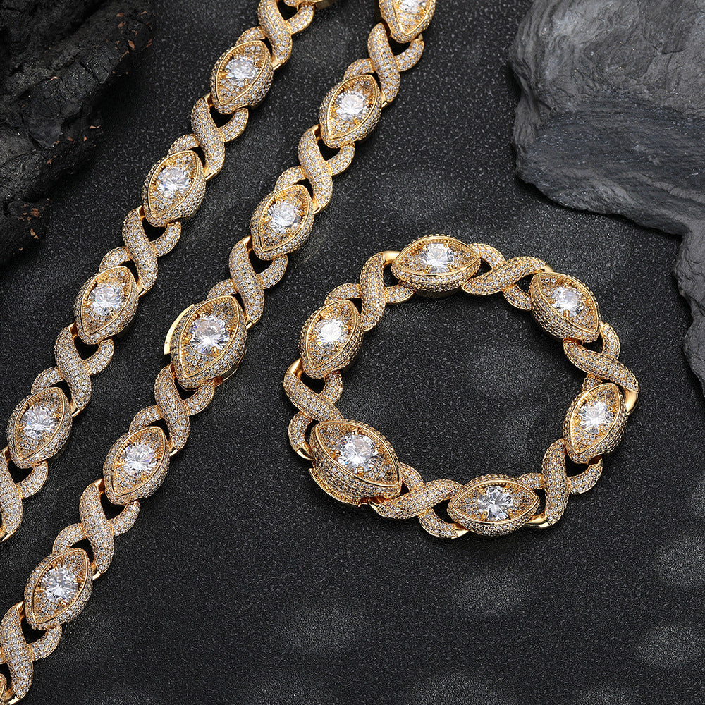 Gold-tone infinity eye-link necklace and matching bracelet on black