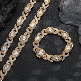 Gold-tone infinity eye-link necklace and matching bracelet on black