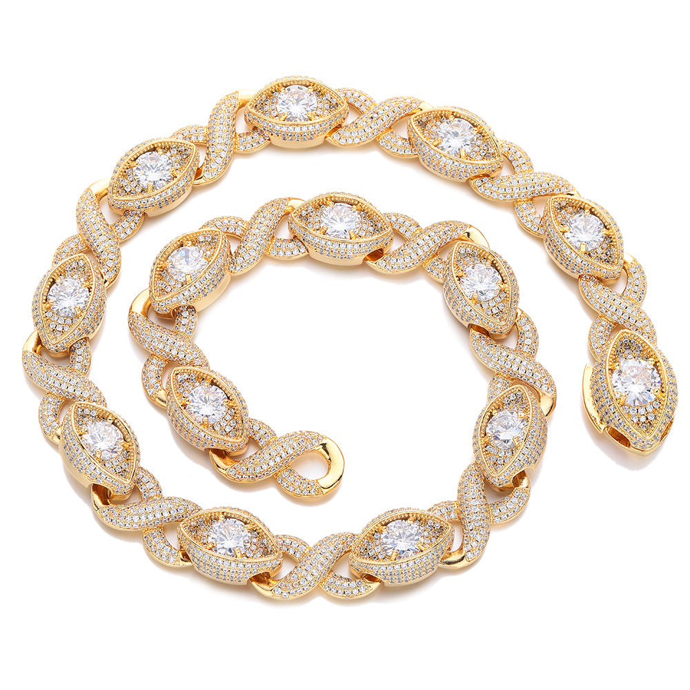 Gold-tone infinity eye-link necklace coiled on white