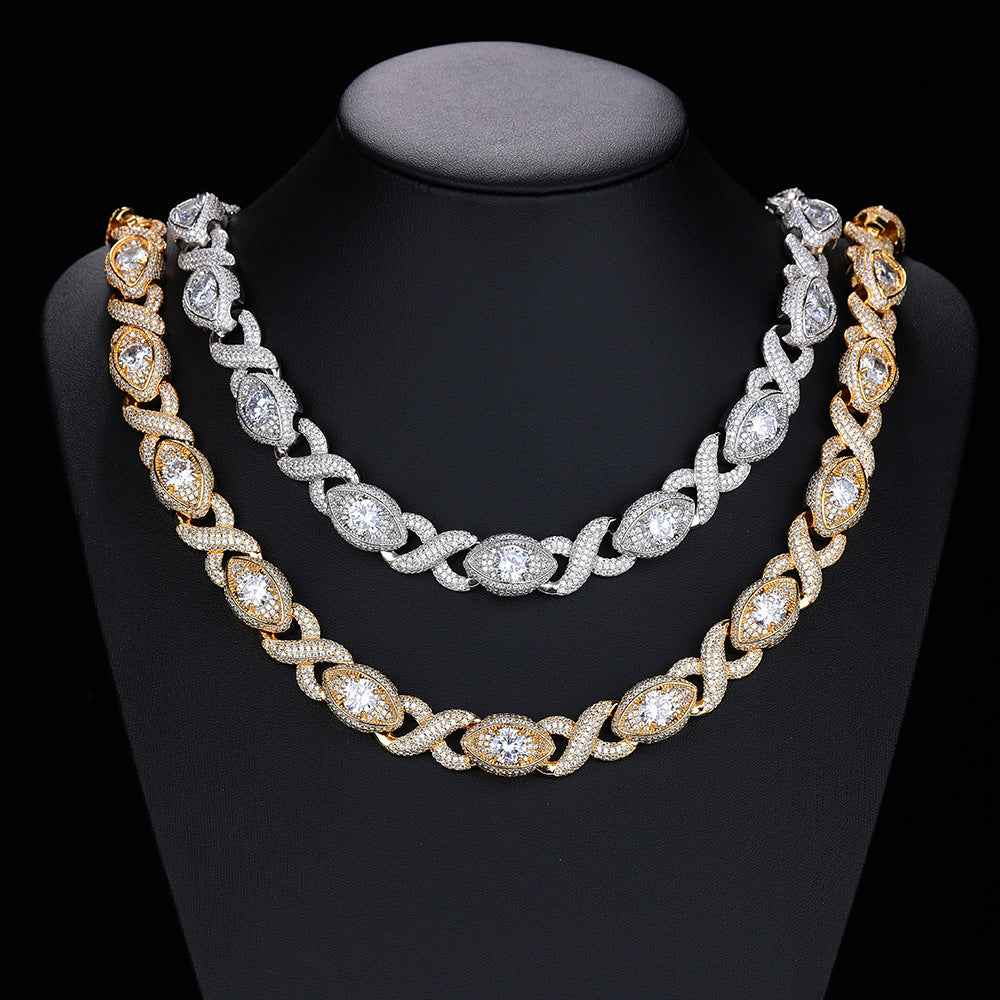 Gold-tone and silver-tone infinity eye-link necklaces on a black display bust