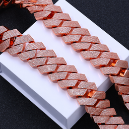 Rose gold-tone pavé Cuban links displayed across a plain white box