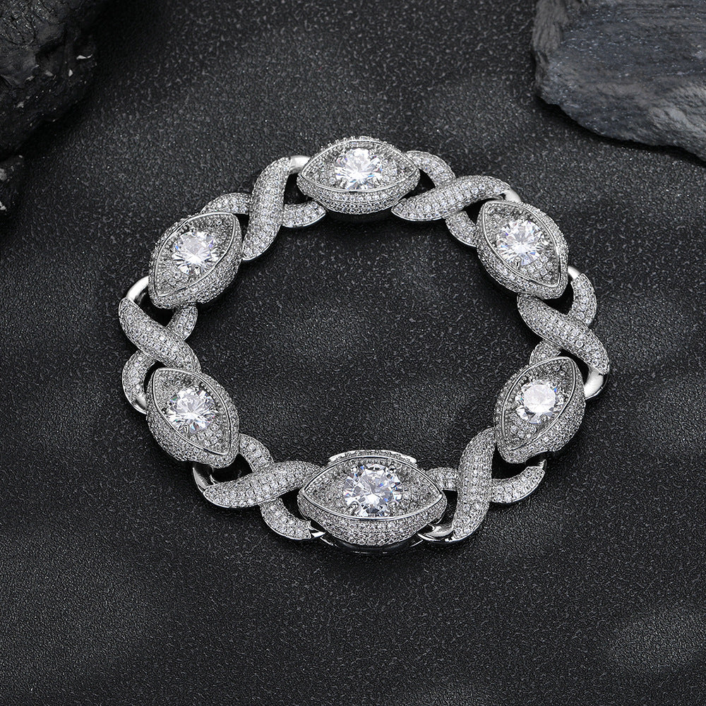 Silver-tone infinity eye-link bracelet on a black surface