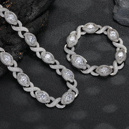 Silver-tone infinity eye-link necklace and matching bracelet on black