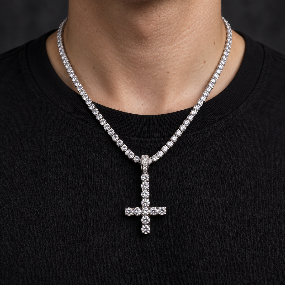 Model wearing a size L silver-tone inverted cross pendant on a tennis chain