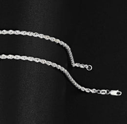 Silver-tone rope chain links with a lobster clasp on black