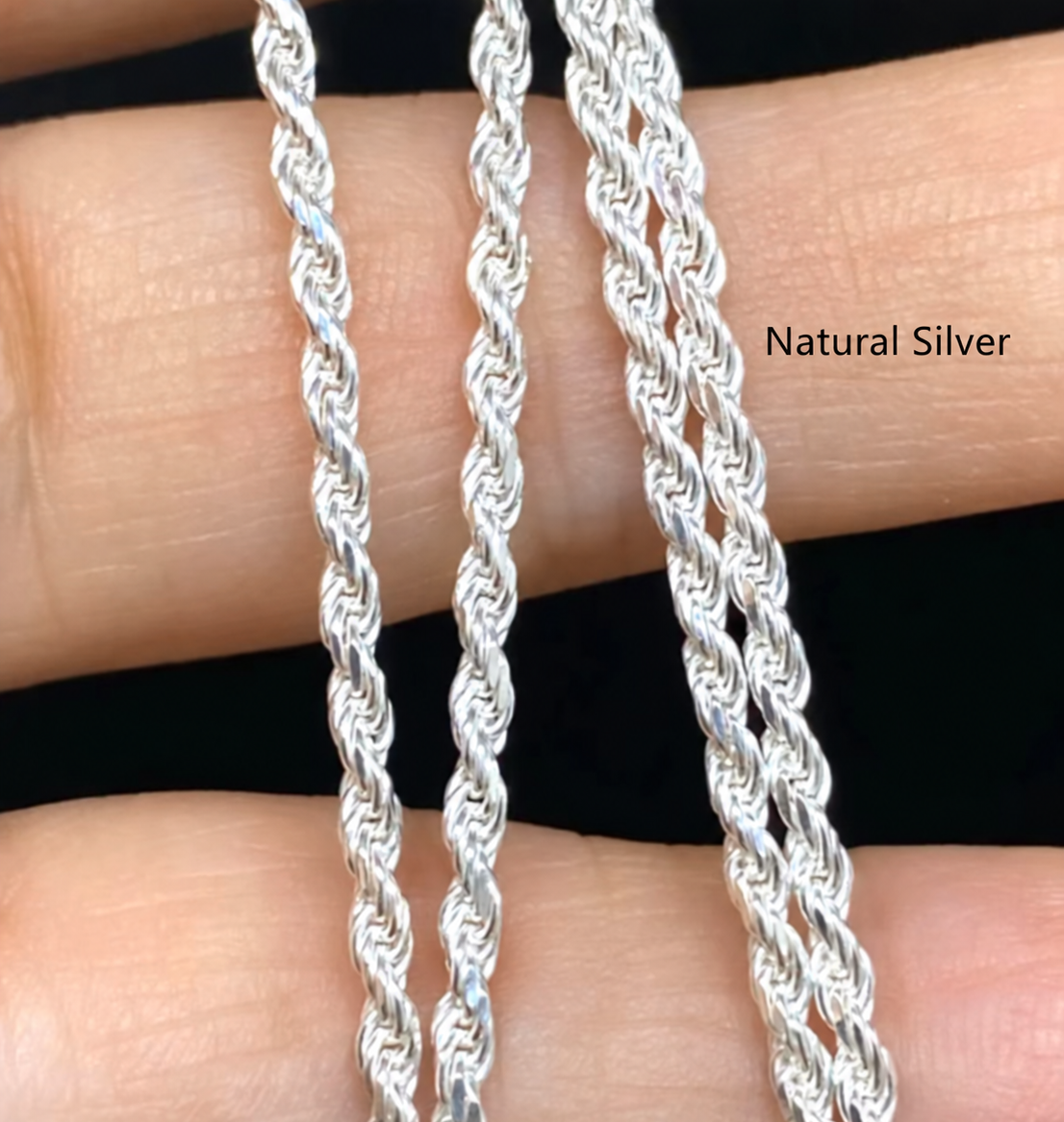Natural Silver rope chain links shown across fingers