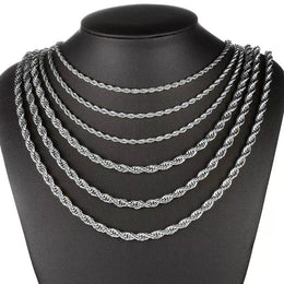 Six silver-tone rope chains draped on a black bust against white