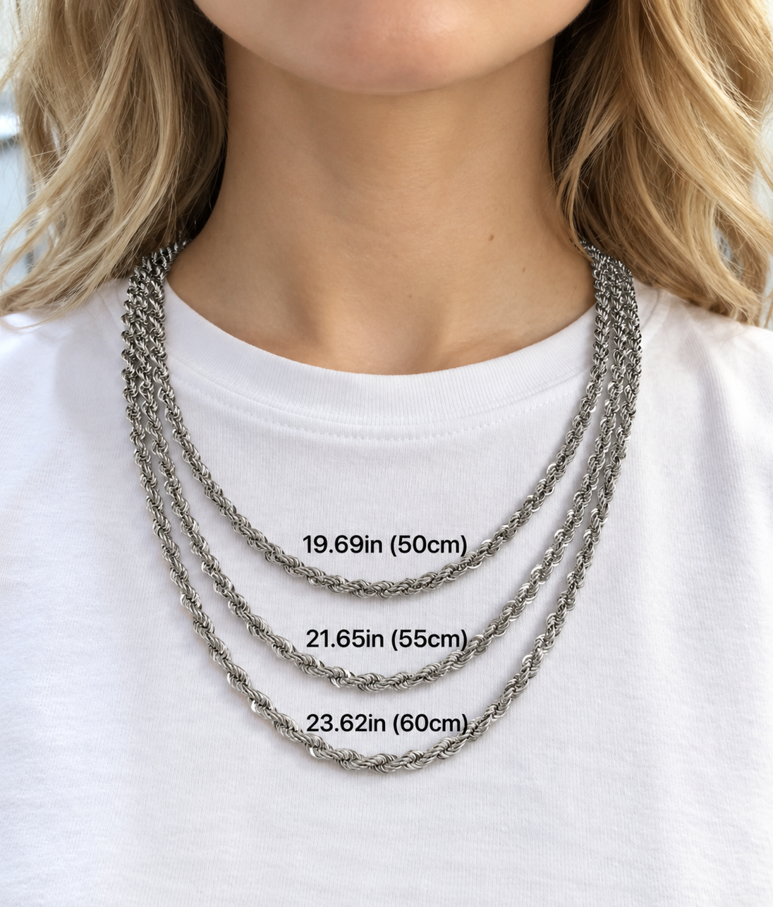 Model wearing three silver-tone rope chains with inch and centimeter length labels