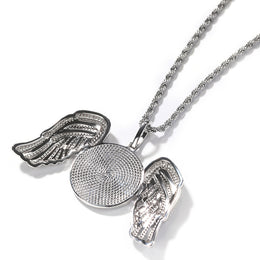 Back of the silver-tone angel wings pendant showing its textured disc and open wing settings