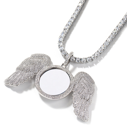 Angled silver-tone angel wings photo pendant showing the raised round frame