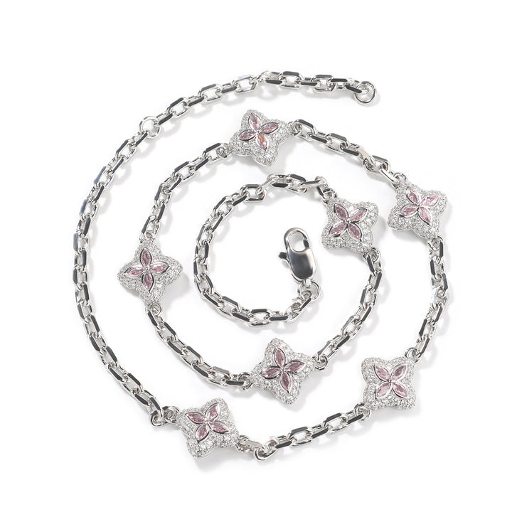 Pink four-leaf clover adjustable necklace in a silver-tone setting on white