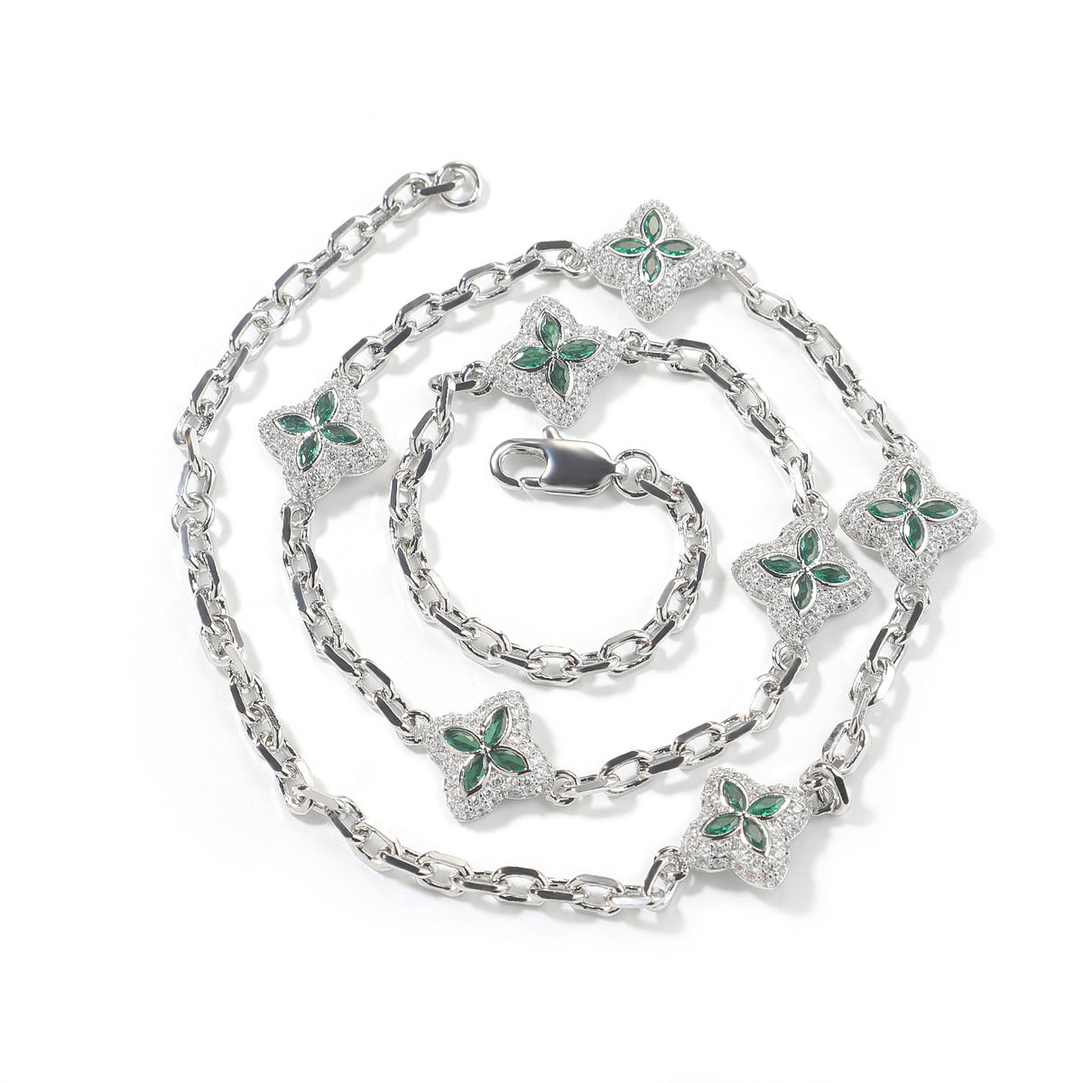 Green four-leaf clover adjustable necklace in a silver-tone setting on white