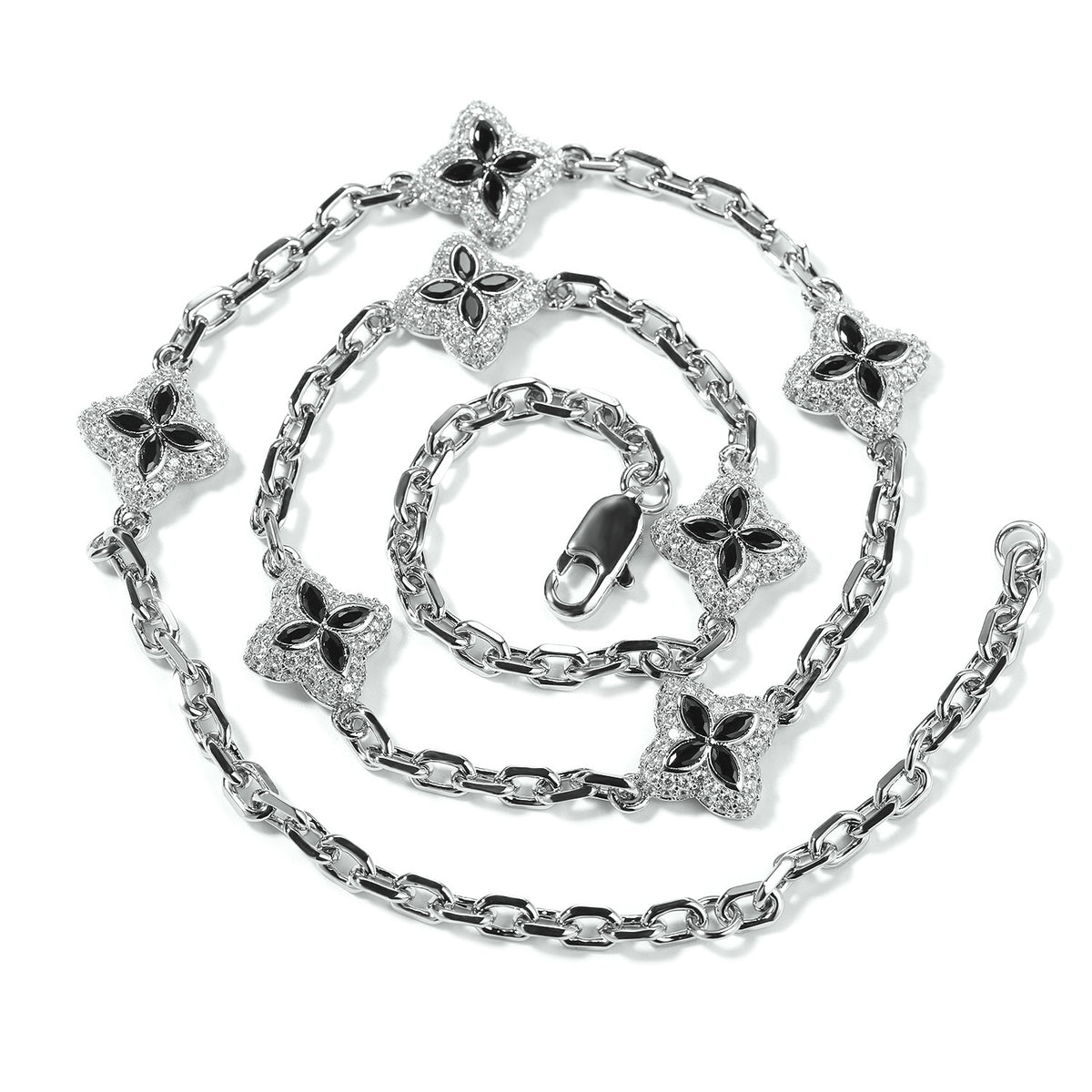Black four-leaf clover adjustable necklace in a silver-tone setting on white