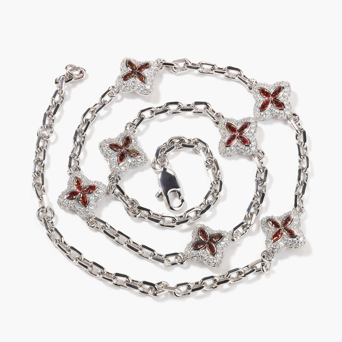 Red four-leaf clover adjustable necklace in a silver-tone setting on white