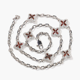 Red four-leaf clover adjustable necklace in a silver-tone setting on white