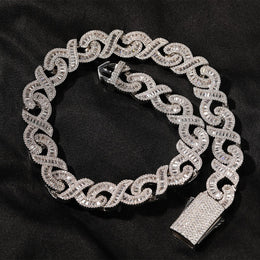 Silver 15mm infinity link necklace coiled on black fabric