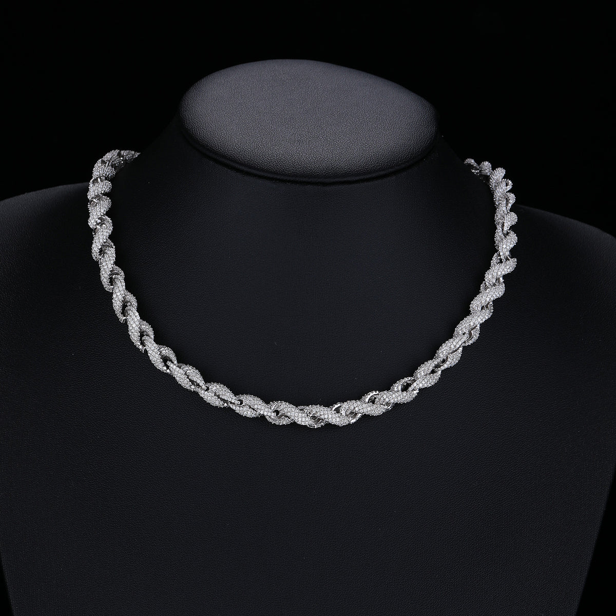 Silver-tone rope necklace displayed on a black necklace bust
