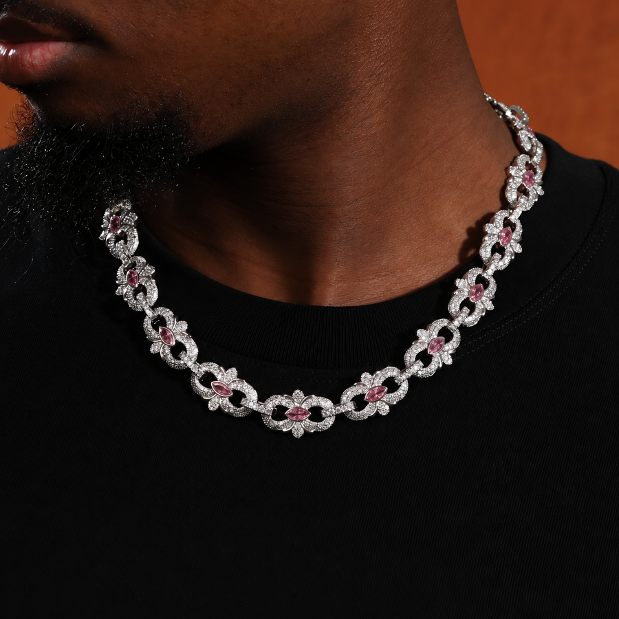Pink marquise floral link necklace worn over a black shirt with the neck turned to the side