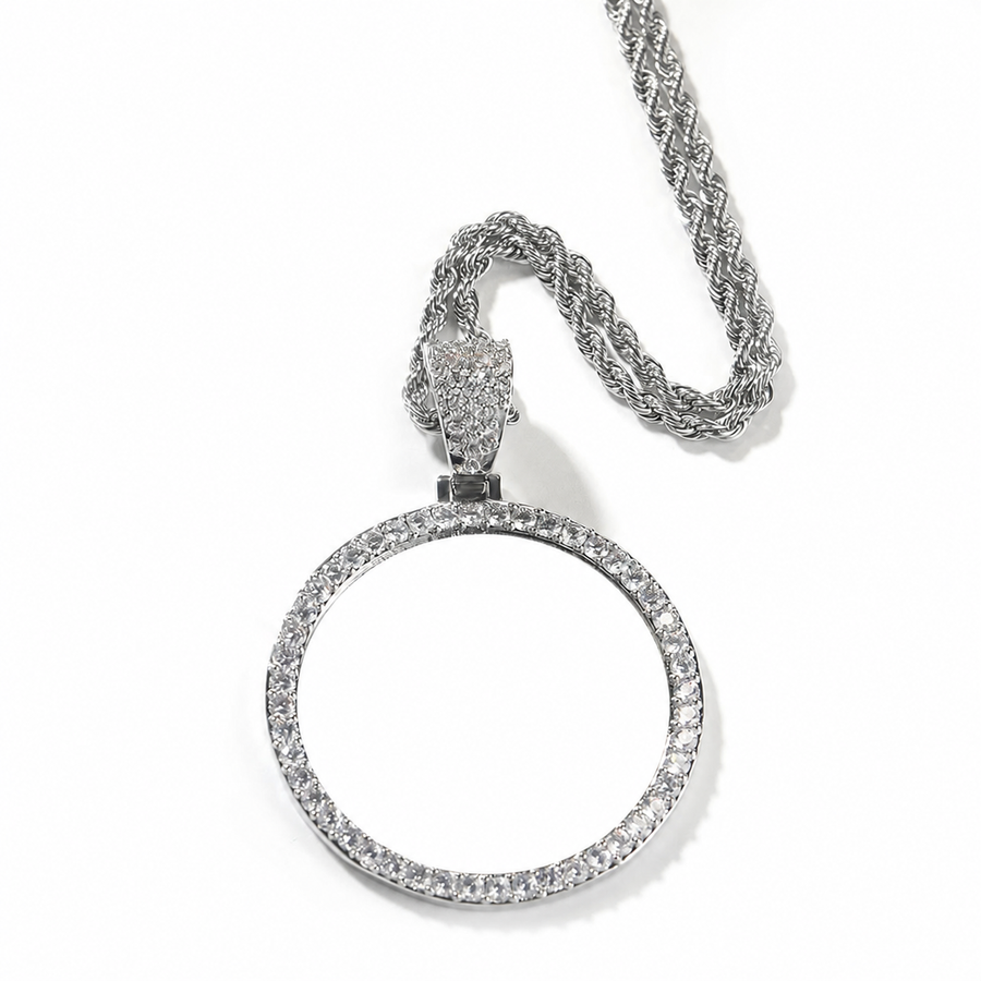 Silver-tone round photo pendant with a blank white center on a rope chain