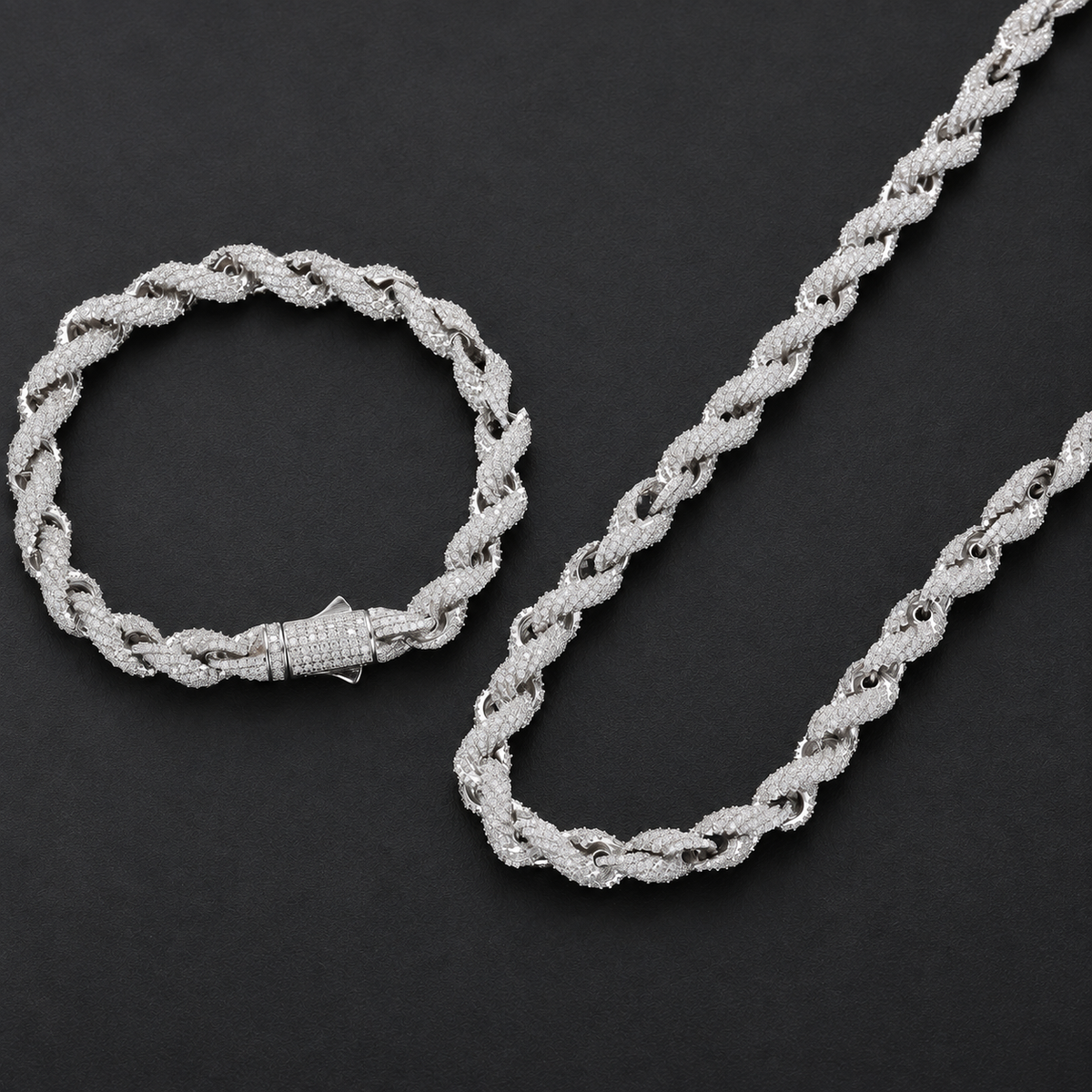 Matching rope bracelet and necklace arranged together on a dark background