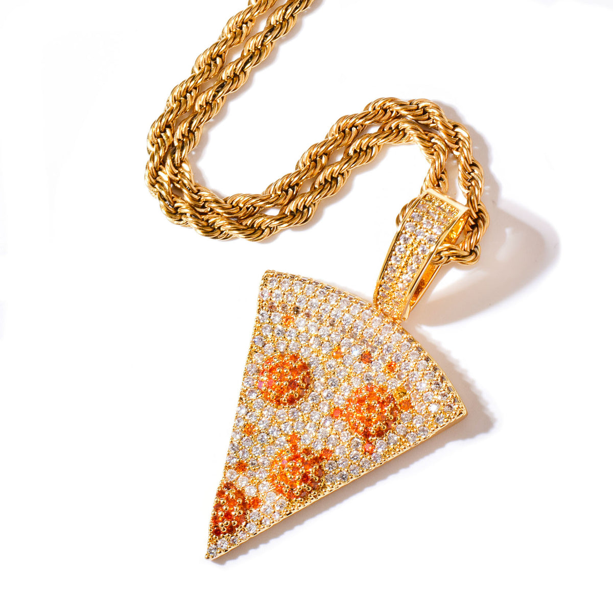 Gold-tone pizza slice pendant with clear and orange stone details on a white background