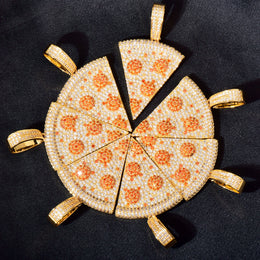 Angled arrangement of gold-tone pizza slice pendants on dark fabric