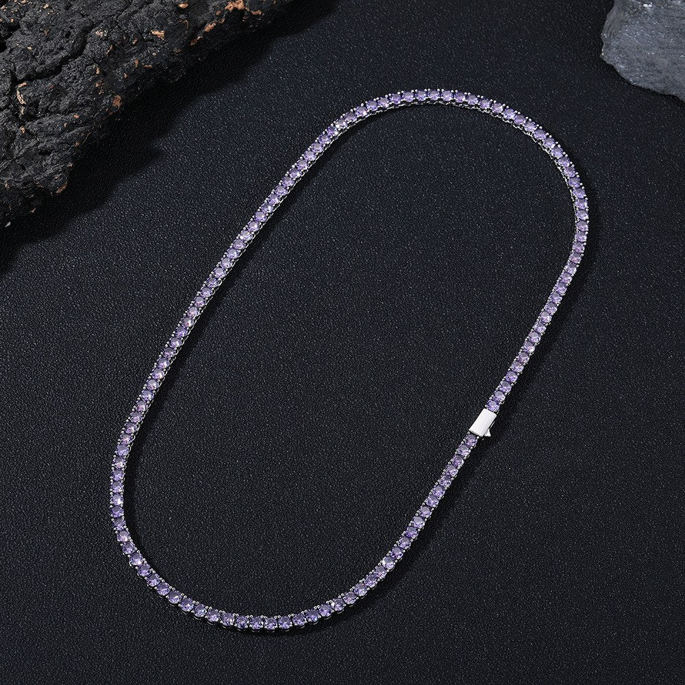 Dark-background detail view of 4mm iced purple CZ tennis chain necklace