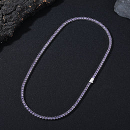 Dark-background detail view of 4mm iced purple CZ tennis chain necklace