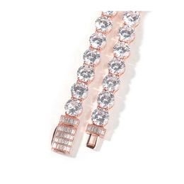 Close-up of the open safety box clasp and rectangular cubic zirconia on a rose-gold-tone tennis chain