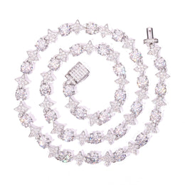 Silver-tone moissanite star tennis necklace coiled on white with an open box clasp