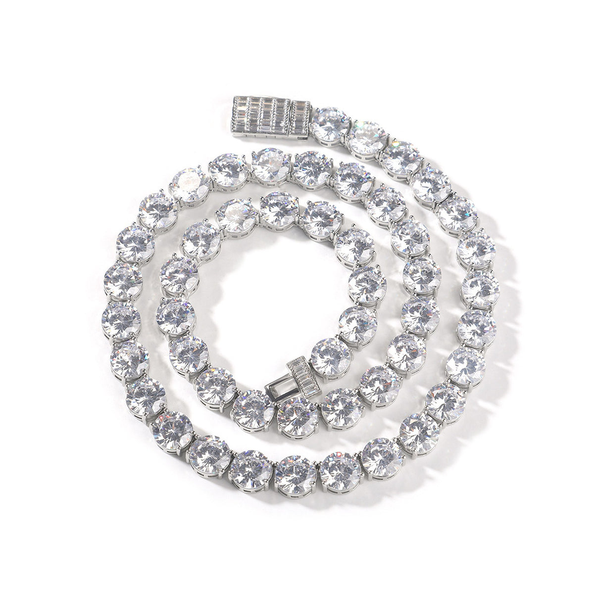 Silver-tone round cubic zirconia tennis chain coiled with the open box clasp visible