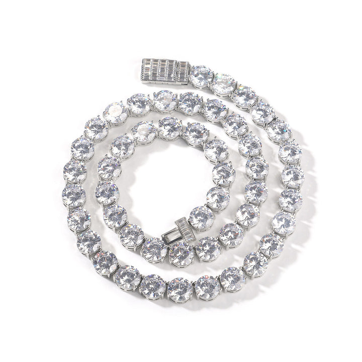 Silver-tone round cubic zirconia tennis chain coiled with the open box clasp visible