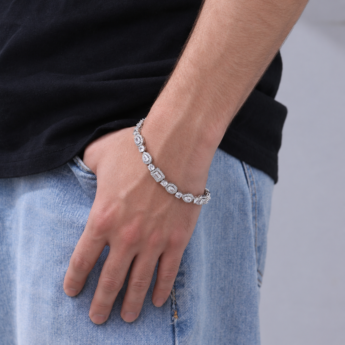 Model wearing a silver-tone geometric halo bracelet with a black shirt