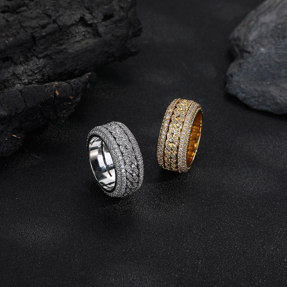 Silver-tone and gold-tone Cuban link rings displayed together on black