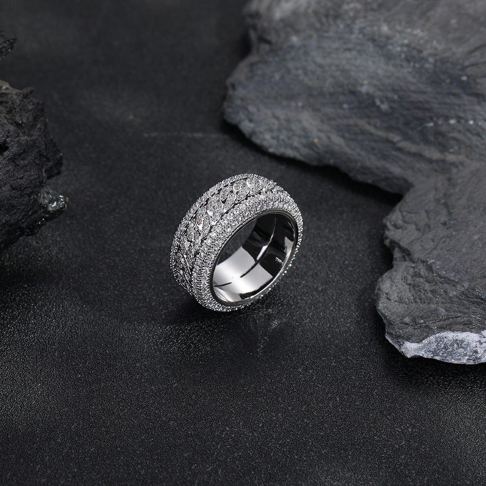Silver-tone Cuban link ring showing the polished inner band and stone-set rims