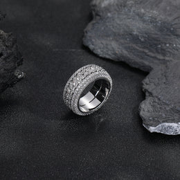 Silver-tone Cuban link ring showing the polished inner band and stone-set rims