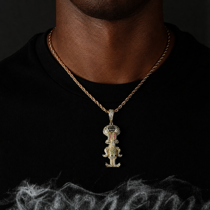 Gold-tone cartoon squid pendant worn over a black shirt