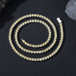 Dark-background detail view of 4mm iced yellow CZ tennis chain necklace
